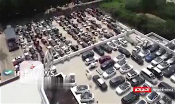 تصاویر هوایی از خودروهای لاکچری آسیب دیده در نمایشگاه چین پس از وقوع سیل