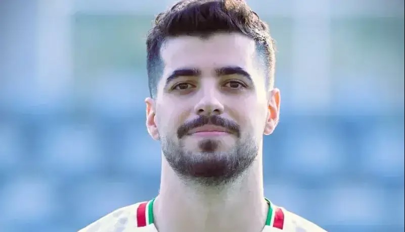 سعید عزت همراه قلعه‌نویی در کنفرانس بلژیک